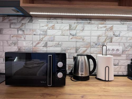 Kuchyň nebo kuchyňský kout v ubytování Apartman NIKOLINA