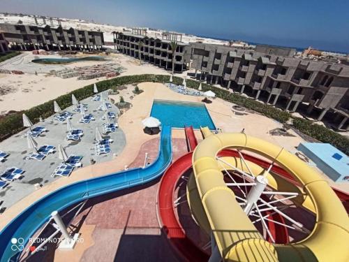 a view of a water slide at a resort at بورتو مطروح - Porto Matrouh in Marsa Matruh