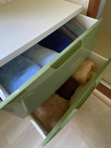 a drawer with green dividers in a desk at Shiro の秘密基地 in Ōmagari