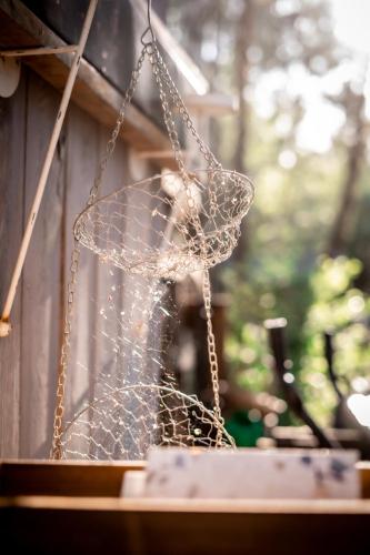 a dog is sitting in a net at WieloHome in Wielogóra