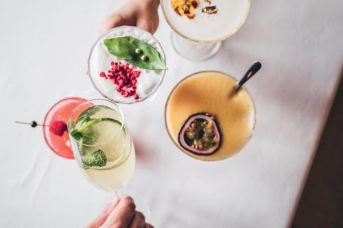 a group of three drinks on a table at Leonardo Hotel Vinkeveen Amsterdam in Vinkeveen
