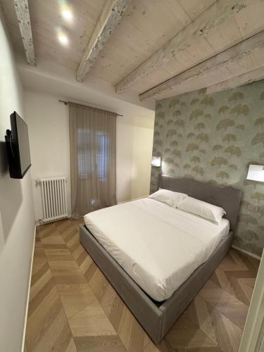 Ένα ή περισσότερα κρεβάτια σε δωμάτιο στο Pedroom Via San Tomaso