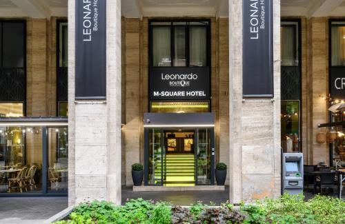 a store front with a green door in a building at Leonardo Boutique Hotel Budapest M-Square in Budapest