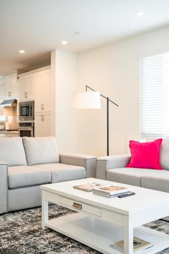 a living room with a couch and a table at Central Location Master Bedroom w Shared Bathroom in Irvine