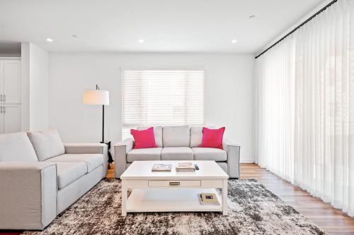 a living room with two couches and a coffee table at Central Location Master Bedroom w Shared Bathroom in Irvine