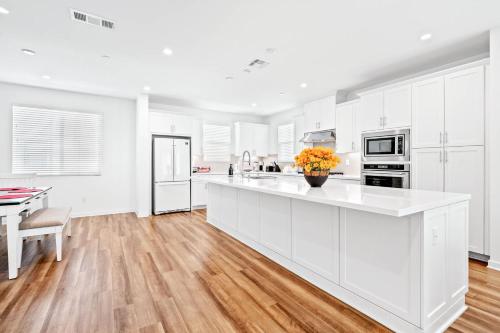 a kitchen with white cabinets and a white counter top at Central Location Master Bedroom w Shared Bathroom in Irvine