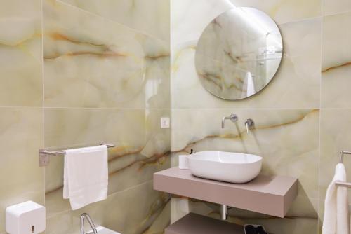 a bathroom with a sink and a mirror at La Terrazza sul Mare in Praia a Mare
