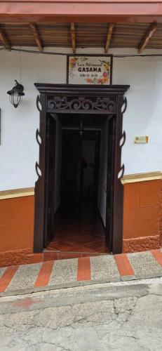 a entrance to a building with a sign on the wall at Casa Patrimonial Abejorral - CASA GASAMA in Abejorral