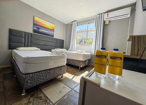 Katil atau katil-katil dalam bilik di Pecém Hotel