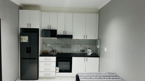 Kuchyň nebo kuchyňský kout v ubytování MARI Guesthouse