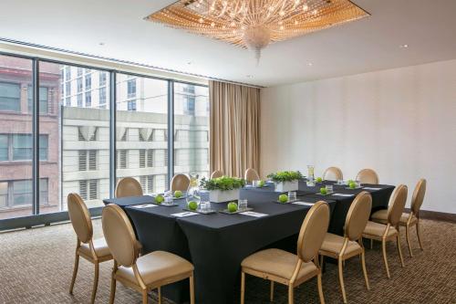 a conference room with a long table and chairs at The Royal Sonesta Chicago River North in Chicago