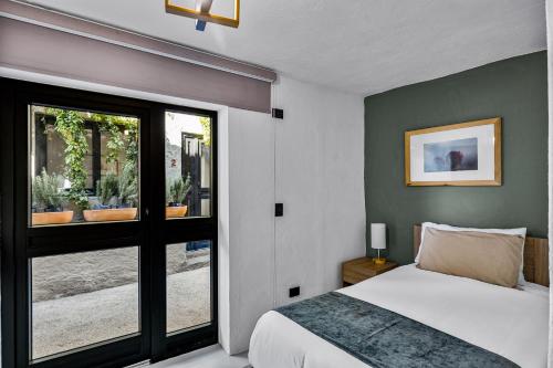 Ένα ή περισσότερα κρεβάτια σε δωμάτιο στο Hotel Bonito