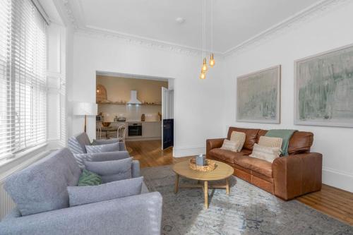 a living room with two couches and a table at Bridge Street Luxurious 2 Bed, 2 Bathroom Apt in Arbroath
