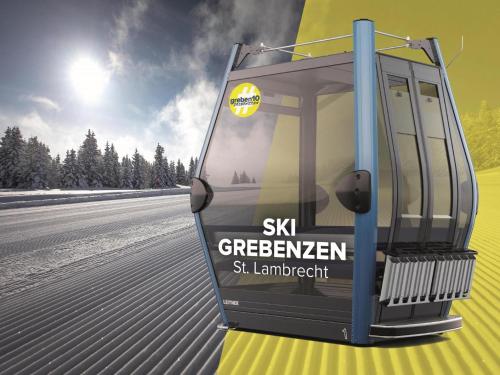 a bus on a road with the words skg greenkeeper at Grebenzen Lodge 1028 in Sankt Lambrecht