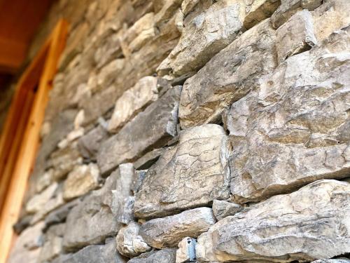 a close up of a stone wall at Grebenzen Lodge 1028 in Sankt Lambrecht