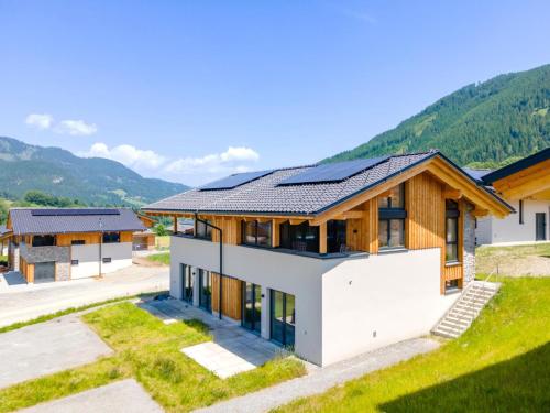 a house with solar panels on the roof at Grebenzen Lodge 51 in Sankt Lambrecht