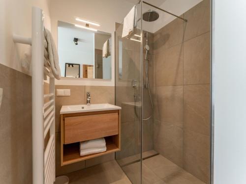 a bathroom with a sink and a shower at Grebenzen Lodge 51 in Sankt Lambrecht