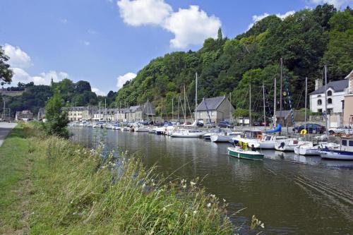 a group of boats are docked in a marina at La maison de victorine in Dinan