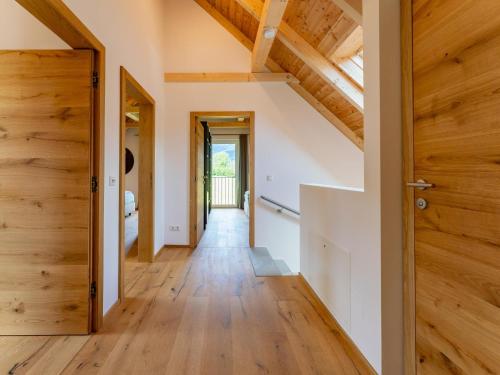 a hallway of a house with wooden floors and a door at Mountain Chalet An der Mur in Sankt Lorenzen ob Murau