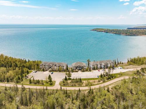 an aerial view of a resort with the lake at Amazing Superior Lake View Condo and Heated Pools in Two Harbors