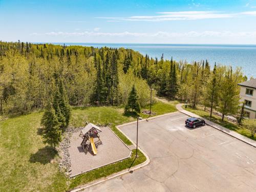 an overhead view of a parking lot with a car at Amazing Superior Lake View Condo and Heated Pools in Two Harbors