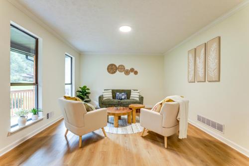 a living room with two chairs and a table at 5 Mi to Stone Mountain Family Home in Lithonia