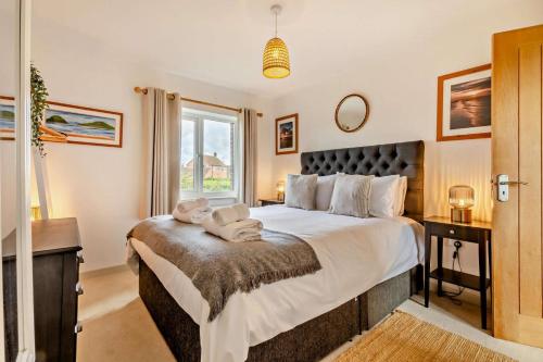 Ένα ή περισσότερα κρεβάτια σε δωμάτιο στο Langham Lodge