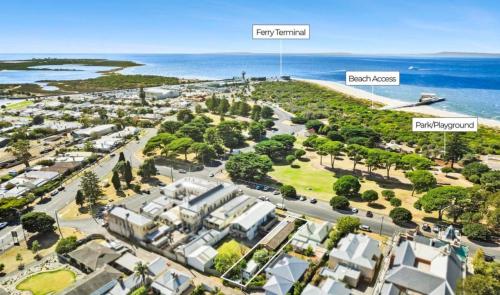 an aerial view of a city with the ocean in the background at Mrs Issy in Queenscliff
