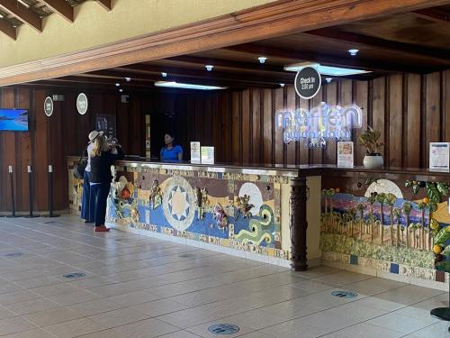 a woman standing at a counter in a building at Apartamento en Puerto Plata Marien Residences in Puerto Plata