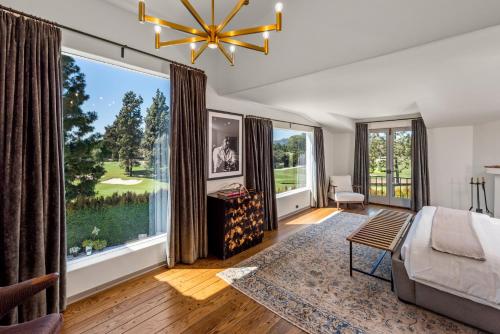 a bedroom with a bed and a large window at Howard Hughes Estate in Los Angeles