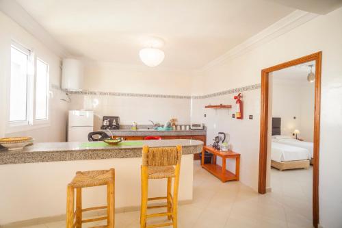 A kitchen or kitchenette at Résidence Louzani