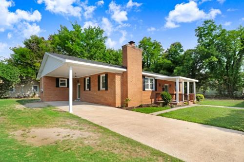 a brick house with a white roof at The EleMEnt in Goldsboro
