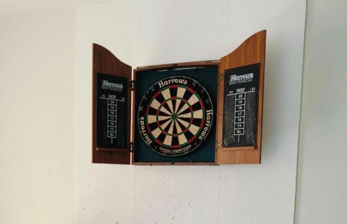 a dart board hanging on a wall at DaLei 2-330 Sleeps 8pax at Marina Spatial Condominium in Dumaguete City in Dumaguete