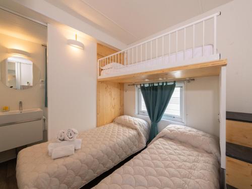 Ένα ή περισσότερα κρεβάτια σε δωμάτιο στο Charming Coastal Stay