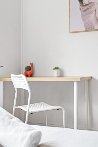 a desk in a bedroom with a chair and a bed at Private Double Room - Centrally Located At Ryde - Shared Bathroom in Sydney