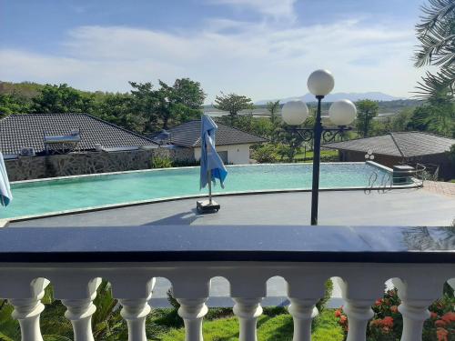 a view of a swimming pool from a balcony at Lakeside Đá Bàng Ecolodge, ấp Tân Hiệp, xã Long Tân, Huyện Đất Đỏ, BRVT in La Sơn