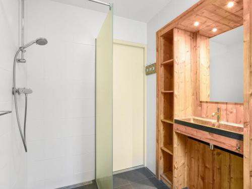 a bathroom with a sink and a shower at Holiday Home in Brabant with Garden & BBQ 