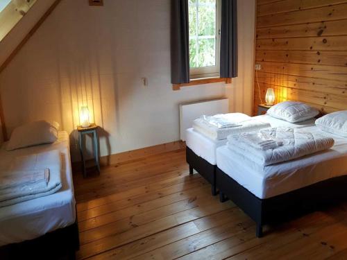 Ένα ή περισσότερα κρεβάτια σε δωμάτιο στο Spacious Stay Near Veluwe