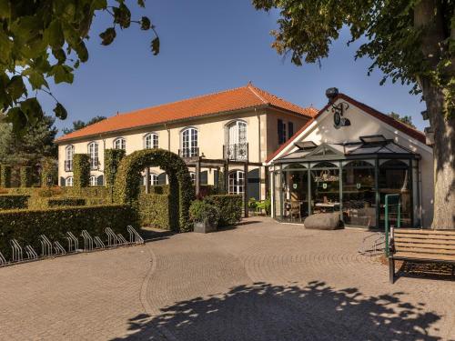 a building with a bench in front of it at Holiday Home in Diessen near Tilburg 