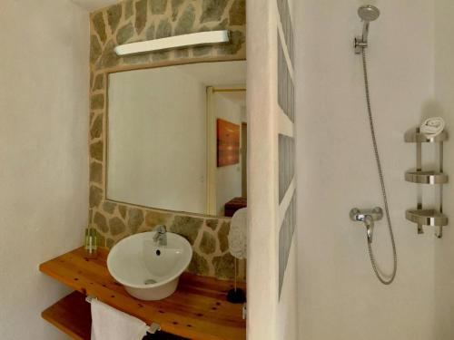 a bathroom with a sink and a mirror at Villa in Cala Vadella with Private Pool in San Jose