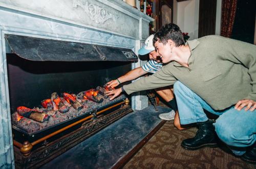 a man is cooking food in an oven at Phillip Island Park Lane Holiday Park in Cowes