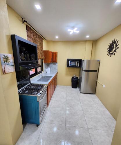 a kitchen with a stove and a refrigerator at Carolina Point Resort in Crown Point