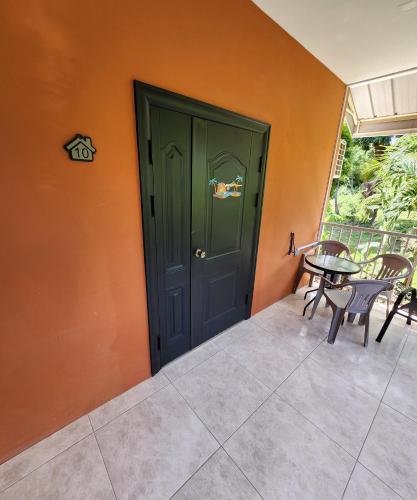 a door to a patio with a table and chairs at Carolina Point Resort in Crown Point