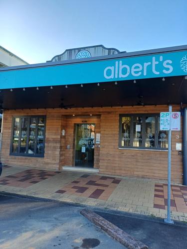 a store with a sign on the front of it at Alberts Est 2017 in Innisfail