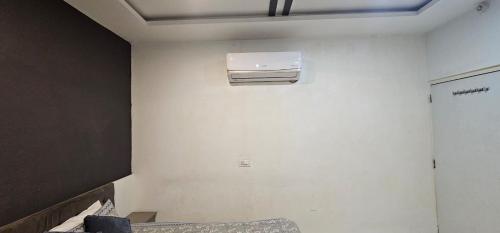 a room with a air conditioner on the wall at Hotel 1947 & Labella Rooftop Cafe in Pushkar