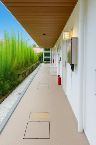 a hallway of a building with a walkway at アロハ鎌倉 in Kamakura