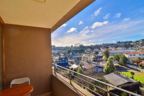 a balcony with a view of a city at HOM I Depto con parking incluido 1D1B in Puerto Varas