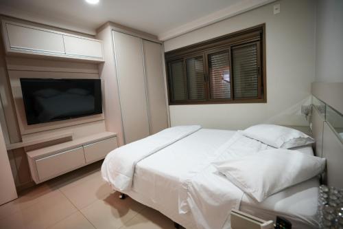 Postel nebo postele na pokoji v ubytování Foz Cobertura 3 suítes e Foz Apartamento 2 suítes