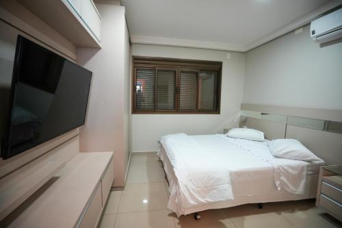 Postel nebo postele na pokoji v ubytování Foz Cobertura 3 suítes e Foz Apartamento 2 suítes