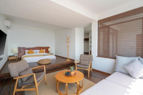 Postel nebo postele na pokoji v ubytování Manwu Dali Jimu Boutique Guesthouse